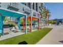 Poolside cabanas with comfortable seating offer a shaded retreat for relaxation and enjoyment at 353 E Bonneville Ave # 463, Las Vegas, NV 89101