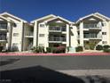 Low-angle exterior showcasing the condos with second and third-floor balconies at 3550 Bay Sands Dr # 3044, Laughlin, NV 89029