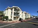 Exterior of condos displaying multiple balconies surrounded by greenery at 3550 Bay Sands Dr # 3044, Laughlin, NV 89029