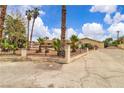 Inviting home with well-maintained grounds and secure gated entry at 4678 Saddle Pl, Las Vegas, NV 89119
