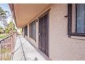 Apartment exterior featuring an outdoor balcony and metal window security bars at 605 S Royal Crest Cir # 20, Las Vegas, NV 89169