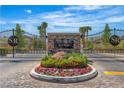 Stetson Ranch gated entrance features stone accents, beautiful flowers, and meticulous landscaping at 6148 Whitelion Walk St, Las Vegas, NV 89148