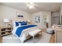 Serene main bedroom featuring plush bedding, soft lighting, and a calm, neutral color palette at 677 Viale Machiavelli Ln, Henderson, NV 89011