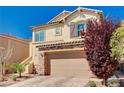 Two-story home showing well maintained landscaping and attached two-car garage at 6773 Bristle Falls St, Las Vegas, NV 89149