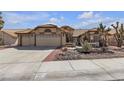 Charming single-story home featuring a three car garage and desert landscaping at 9625 Beach Water Cir, Las Vegas, NV 89117