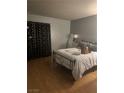 Bedroom features wood floors and black curtains on the window at , Las Vegas, NV 89108