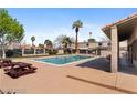 Outdoor community pool with picnic tables and well-maintained landscaping at , Las Vegas, NV 89108
