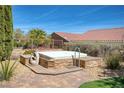 Outdoor hot tub features a custom deck, privacy landscaping, and is perfect for relaxation and entertainment at 1074 Wagon Trl, Mesquite, NV 89034