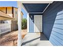 A covered front porch features white posts and a white security door at 1315 Chatsworth Ct, Las Vegas, NV 89142