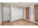 Cozy bedroom with wood floors, closet and neutral paint color at 257 N Lamb Blvd # E, Las Vegas, NV 89110