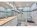 Modern bathroom featuring a glass shower, dual sinks, and stylish tile accents at 263 Baring Cross St, Henderson, NV 89074