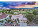 Beautiful aerial view of a home on a golf course with lush landscaping at 2729 Echo Mesa Dr, Las Vegas, NV 89134
