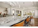 Kitchen with a large island and granite countertops and island seating at 2729 Echo Mesa Dr, Las Vegas, NV 89134