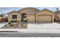 Charming single-story home with a well-maintained lawn and a spacious two-car garage at 306 Saint Augustine Ln, Henderson, NV 89014