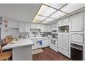 Bright kitchen with white cabinets, modern appliances, and ample counter space for meal preparation at 3323 Maclyon Way, Las Vegas, NV 89121