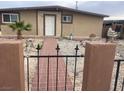 Inviting single-story home featuring a charming brick pathway and desert landscaping at 3616 Reynolds Ave, North Las Vegas, NV 89030