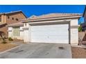 The front exterior shows a garage with a desert landscape and a glimpse of nearby houses at 5046 Great Abaco St, North Las Vegas, NV 89031