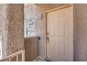 Condo front door showing the lockbox and unit number 2046 at 5250 S Rainbow Blvd # 2046, Las Vegas, NV 89118