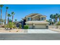 Charming home with a three-car garage and desert landscaping at 5640 Coe Estates Ct, Las Vegas, NV 89149