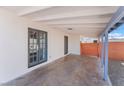 Cozy covered patio with access to the house through gray framed french doors at 6213 Burgundy Way, Las Vegas, NV 89107