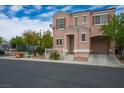 Charming two-story home with a cozy front porch and attached garage, complemented by well-maintained landscaping at 6234 Pangea Ave, Las Vegas, NV 89139