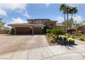 Charming two-story home with a three-car garage and meticulously landscaped front yard at 637 Edgebrook Dr, Las Vegas, NV 89145