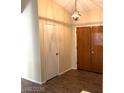 Hallway featuring wood-look tile floors and classic neutral wall paint at 6632 Coastal Breeze Ct, Las Vegas, NV 89108