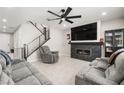 Cozy living room boasts a fireplace with marble surround, recessed lighting, modern ceiling fan, and comfortable seating at 70 Pikiariki Ct, Las Vegas, NV 89183