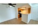 Cozy kitchen view highlighting tile floors, cabinetry and stainless steel appliances at 7100 Pirates Cove Rd # 1022, Las Vegas, NV 89145