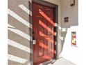 Inviting front door with prominent numbering and a convenient fire extinguisher box at 950 Seven Hills Dr # 2418, Henderson, NV 89052