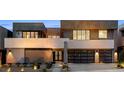 Contemporary two-story home with a desert landscaped front yard, walkway, and two-car garage at 1172 Monte De Luz Way, Henderson, NV 89012