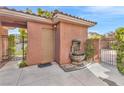Exterior features a water feature, private courtyard and gated entry to the property at 11730 Stonewall Springs Ave, Las Vegas, NV 89138