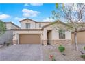Charming two-story home with stone accents, a well-maintained yard, and a paved driveway at 1909 Pinsky Ln, North Las Vegas, NV 89032