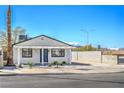 Charming home featuring a well-manicured yard and driveway at 1945 Margarita Ave, Henderson, NV 89011