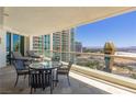 Balcony featuring cityscape views, outdoor seating, and sun loungers, perfect for relaxation at 2877 Paradise Rd # 2203, Las Vegas, NV 89109