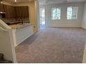 Bright, open-concept living area with plush carpeting and lots of natural light at 3667 Inspirato Ave, Henderson, NV 89044
