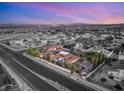 Aerial view of the property showcasing its layout, landscaping, and proximity to the city at 4775 N Tee Pee Ln, Las Vegas, NV 89129
