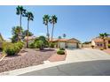 Attractive single-story home with palm trees and well-maintained gravel landscaping at 5217 Cold River Ave, Las Vegas, NV 89130