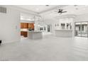 Bright, open-concept living room with modern decor and bright white flooring at 540 Regents Gate Dr, Henderson, NV 89012