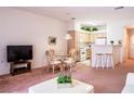 Cozy living room featuring a dining area and a view into the kitchen at 5415 W Harmon Ave # 1119, Las Vegas, NV 89103