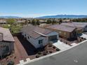 Attractive single-story home featuring a low-maintenance yard and a two-car garage at 5675 E La Campana Dr, Pahrump, NV 89061