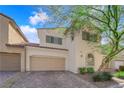 Charming two-story home features a two-car garage and meticulously landscaped front yard at 5832 Sleepy Willow St, Las Vegas, NV 89148
