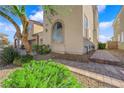 View of the exterior of the home, showcasing well-maintained landscaping and charming architectural details at 5832 Sleepy Willow St, Las Vegas, NV 89148