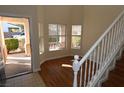Open entryway with wood-look floors, windows, and a view of the home's exterior at 6020 Genovese Ave, Las Vegas, NV 89141