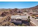 Spacious hillside home with a large deck, offering stunning scenic views at 879 Judi Pl, Boulder City, NV 89005