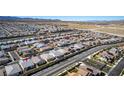 Expansive aerial shot of a neighborhood, showcasing modern homes and community layout at 8944 Skye Canyon Ranch St, Las Vegas, NV 89166