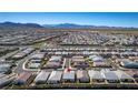 Sweeping aerial view of a Primary-planned community, set against a stunning mountain backdrop at 8944 Skye Canyon Ranch St, Las Vegas, NV 89166