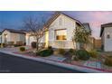 A cozy single-story house with meticulous landscaping featuring shrubs, trees, and decorative rock at 8944 Skye Canyon Ranch St, Las Vegas, NV 89166