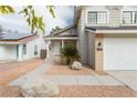 Charming home featuring desert landscaping, a two car garage, and quaint porch at 9004 Crystal Glass Dr, Las Vegas, NV 89117