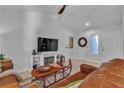 Cozy living room features a TV, fireplace, and comfortable seating, perfect for relaxation at 9037 Grayling Dr, Las Vegas, NV 89134